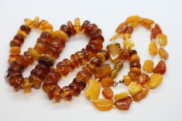 TWO BEADED STRUNG AMBER TYPE NECKLACES, L 50 & L 48CM.