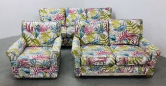 A MODERN TURQUOISE GREEN AND PINK LEAF DESIGN UPHOLSTERED EASY CHAIR ALONG WITH MATCHING THREE