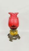 ANTIQUE ORNATE OIL LAMP WITH LARGE DECORATIVE CRANBERRY GLASS SHADE ON CAST METAL TWO HANDLED BASE,