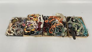 AN EXTENSIVE GROUP OF ASSORTED COSTUME JEWELLERY, BEADED NECKLACES, BANGLES, EARRINGS AND WATCHES.