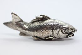 A VINTAGE WHITE METAL VESTA IN THE FORM OF A FISH.