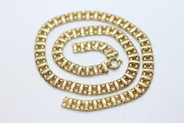 A 9CT GOLD FANCY LINK NECKLACE, BROKEN.