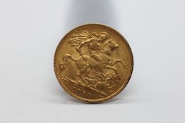 A 1913 HALF SOVEREIGN COIN.