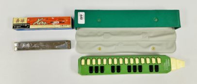 A CASED HOHNER MELODICA-SOPRANO MUSICAL INSTRUMENT AND A HERO HARMONICA IN ORIGINAL BOX.
