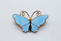 A DESIGNER DAVID ANDERSEN NORWEGIAN SILVER GILT AND BLUE ENAMEL BUTTERFLY BROOCH.