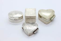 A GROUP OF 4 SILVER AND WHITE METAL TRINKET / PILL BOXES.