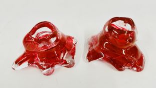 A PAIR OF KOSTA BODA ASA JUNGNELIUS VOTIVE TEA LIGHTS.