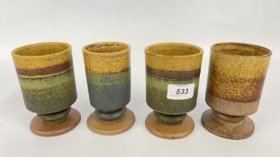 FOUR ROBIN WELCH GOBLETS, BEARING AN IMPRESSED MAKER'S MARK.