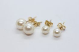 TWO PAIRS OF YELLOW METAL PEARL STUD EARRINGS.