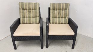 A PAIR OF MODERN BLACK RATTAN STYLE GARDEN CHAIRS.