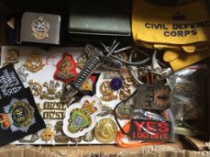 MILITARIA: BOX WITH A VARIED SELECTION BADGES, CLOTH INSIGNIA, QUEENS REGT.