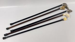 A GROUP OF 5 ASSORTED WALKING STICKS TO INCLUDE A PIG EXAMPLE MARKED 