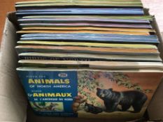 TRADE CARDS: BROOKE BOND CANADIAN SETS STUCK IN ALBUMS, LIGHT DUPLICATION. (16).
