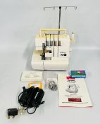 A DELTA OVERLOCKER MODEL OL-1000 WITH USER GUIDE AND FOOT PEDAL - SOLD AS SEEN.