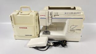 A SINGER ELECTRIC SEWING MACHINE AND SINGER CARRY CASE AND ACCESSORIES - SOLD AS SEEN.