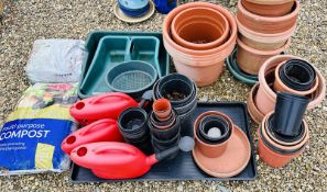 QUANTITY OF LARGE PLASTIC GARDEN PLANTERS, POTTING TRAYS, WATERING CANS AND OTHER FLOWER POTS,