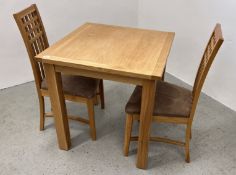 A MODERN LIGHT OAK DINING TABLE 75CM X 75CM ALONG WITH A SET OF TWO MODERN LIGHT OAK DINING CHAIRS.