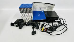 A SONY PLAYSTATION 2 CONSOLE WITH GAMING ACCESSORIES AND GAMES - SOLD AS SEEN.