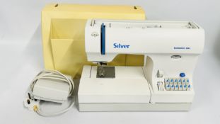 A SILVER ELEGANCE 3084 SEWING MACHINE AND FOOT PEDAL (BODY A/F) - SOLD AS SEEN.
