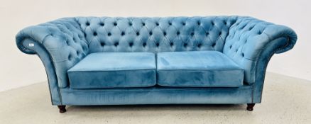 A MODERN TEAL BLUE VELOUR UPHOLSTERED CHESTERFIELD STYLE SOFA, W 220CM.