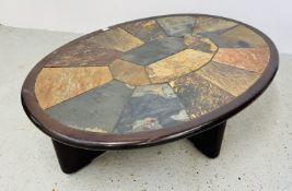 A DANISH VAN BENNOKAM OVAL COFFEE TABLE WITH INSET STONE TOP - WIDTH 136CM.