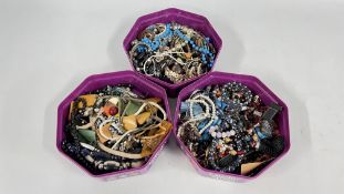 THREE TUBS CONTAINING AN EXTENSIVE GROUP OF ASSORTED COSTUME JEWELLERY, BEADED NECKLACES,