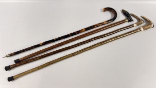 A GROUP OF 4 ASSORTED WALKING STICKS TO INCLUDE HORN HANDLED EXAMPLES.