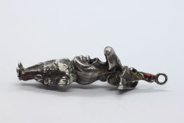 A WHITE METAL NAPOLEON CHARACTER PENDANT.
