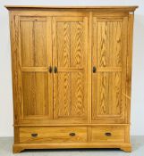 A MODERN SOLID LIGHT OAK TRIPLE WARDROBE WITH DRAWER TO BASE.