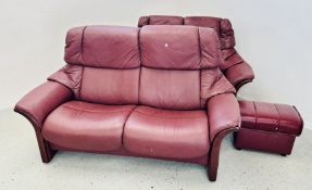 TWO STRESSLESS LEATHER BURGUNDY UPHOLSTERED RECLINER SOFAS WITH A FOOTSTOOL.