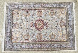 A PERSIAN DESIGN CARPET, 285CM X 185CM.