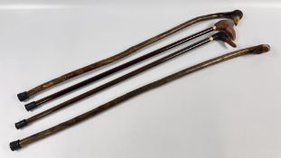 A GROUP OF 4 WALKING STICKS TO INCLUDE CARVED DUCK EXAMPLES.