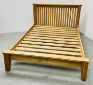A GOOD QUALITY SOLID OAK DOUBLE BED FRAME.