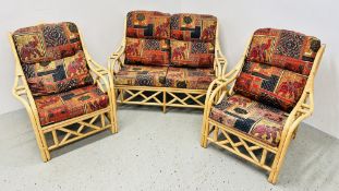 A 3 PIECE CANE CONSERVATORY SUITE COMPRISING OF TWO ARM CHAIRS AND TWO SEATER SOFA.