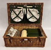 AN OPTIMA WICKER PICNIC BASKET AND CONTENTS MADE EXCLUSIVELY FOR THE JOHN LEWIS PARTNERSHIP (1