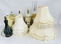 A GROUP OF 6 ITALIAN DESIGN LAMP BASES WITH A GROUP OF GOOD QUALITY FRINGED SHADES - SOLD AS SEEN.