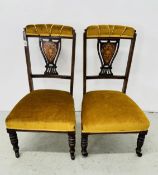 A PAIR OF ROSEWOOD EDWARDIAN NURSING CHAIRS, THE BACKS INLAID WITH DECORATIVE SPLAT,