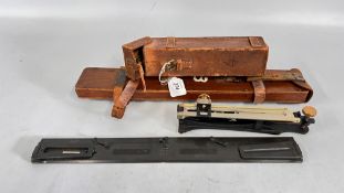 A VINTAGE STANLEY CLINOMETER IN A BROWN LEATHER CASE ALONG WITH A WWII MILITARY BLACK LACQUERED