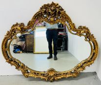 A LARGE AND IMPRESSIVE ORNATE GILT FRAMED MIRROR, W 146 X H 127CM.