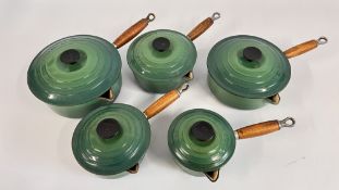 A GROUP OF 5 GRADUATED CAST AND GREEN AND ENAMEL 