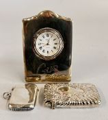 A VINTAGE SILVER VESTA + A FURTHER ELABORATE EMBOSSED PLATED EXAMPLE + A SILVER MOUNTED MANTEL