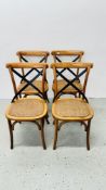 A SET OF FOUR BENTWOOD DINING CHAIRS WITH METAL CRAFT CROSS STRETCHER BACK REST AND RATTAN SEATS.