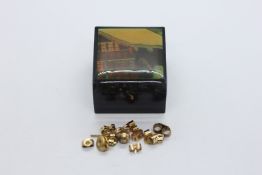 11 X YELLOW METAL BUTTERFLY EARRING BACKS + A YELLOW METAL STUD EARRING.