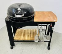 A KETTLE TROLLEY CHARCOAL BARBECUE ALONG WITH VARIOUS BARBECUE ACCESSORIES.