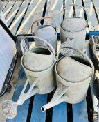 4 VINTAGE GALVANIZED WATERING CANS.