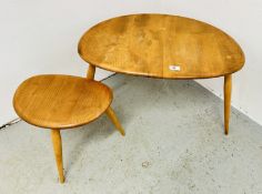 TWO GRADUATED VINTAGE ERCOL STYLE BLONDE PEBBLE OCCASIONAL TABLES (REQUIRE ATTENTION).