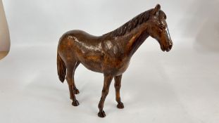 A CARVED WOODEN HORSE SCULPTURE BEARING MONOGRAM AW, H 26.5 X L 31CM.