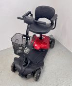 A MOBILITY SCOOTER AND CHARGER - SOLD AS SEEN.
