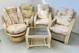A FIVE PIECE CANE CONSERVATORY SUITE COMPRISING 3 ARMCHAIRS AND A FURTHER SWIVEL EXAMPLE AND