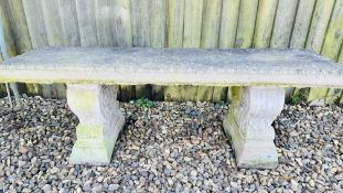 A LARGE CONCRETE GARDEN BENCH ON TWO PILLARS, L 130CM.